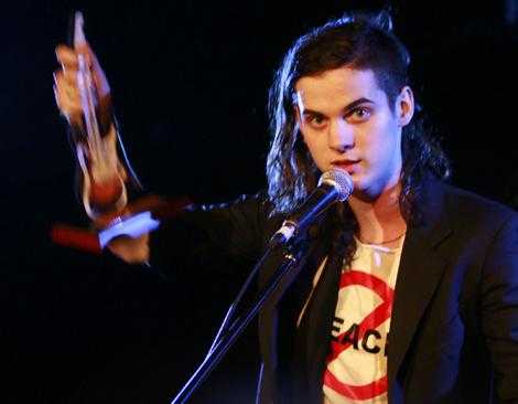 Nick Cave's son, Jethro Lazenby, accepts the award for best album on behalf of the band.