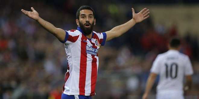 Atletico's Arda Turan reacts during the Champions League quarterfinal first leg soccer match between Atletico Madrid and Real Madrid at the Vicente Calderon stadium in Madrid, Spain, Tuesday, April 14, 2015. (AP Photo/Andres Kudacki)